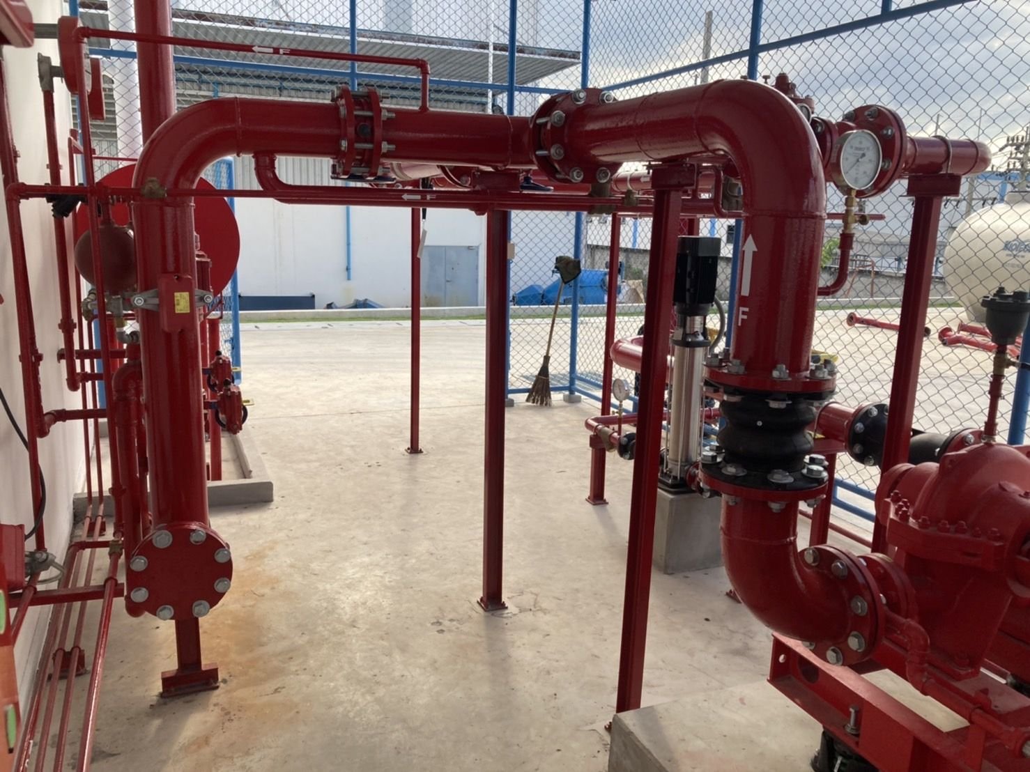 Red fire main pipework with valves and gauges